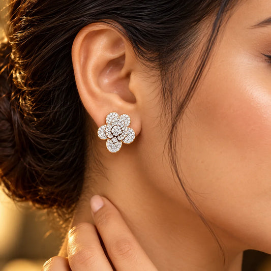 Diamond flower stud earring worn on the ear